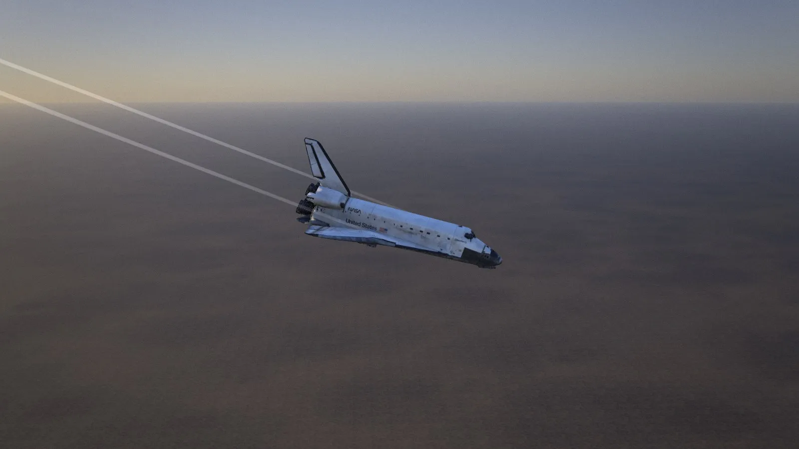 STS-31: Discovery on final approach to Edwards, 45 seconds before touchdown, two vortex trails spinning off its wingtips